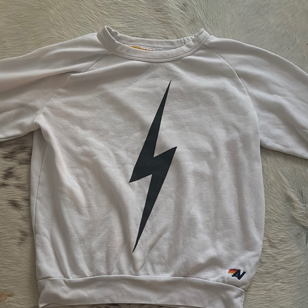 White Sweatshirt with Black Lightning Bolt